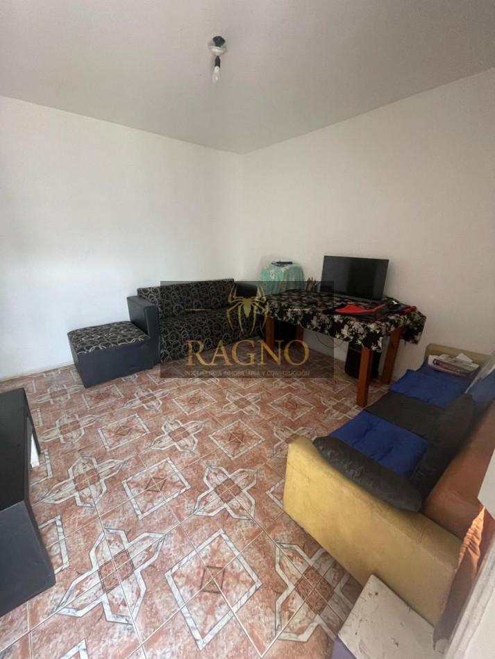 Casa de dos dormitorios con cochera y patio con escritura en barrio talleres sud zona libertad sabatini
